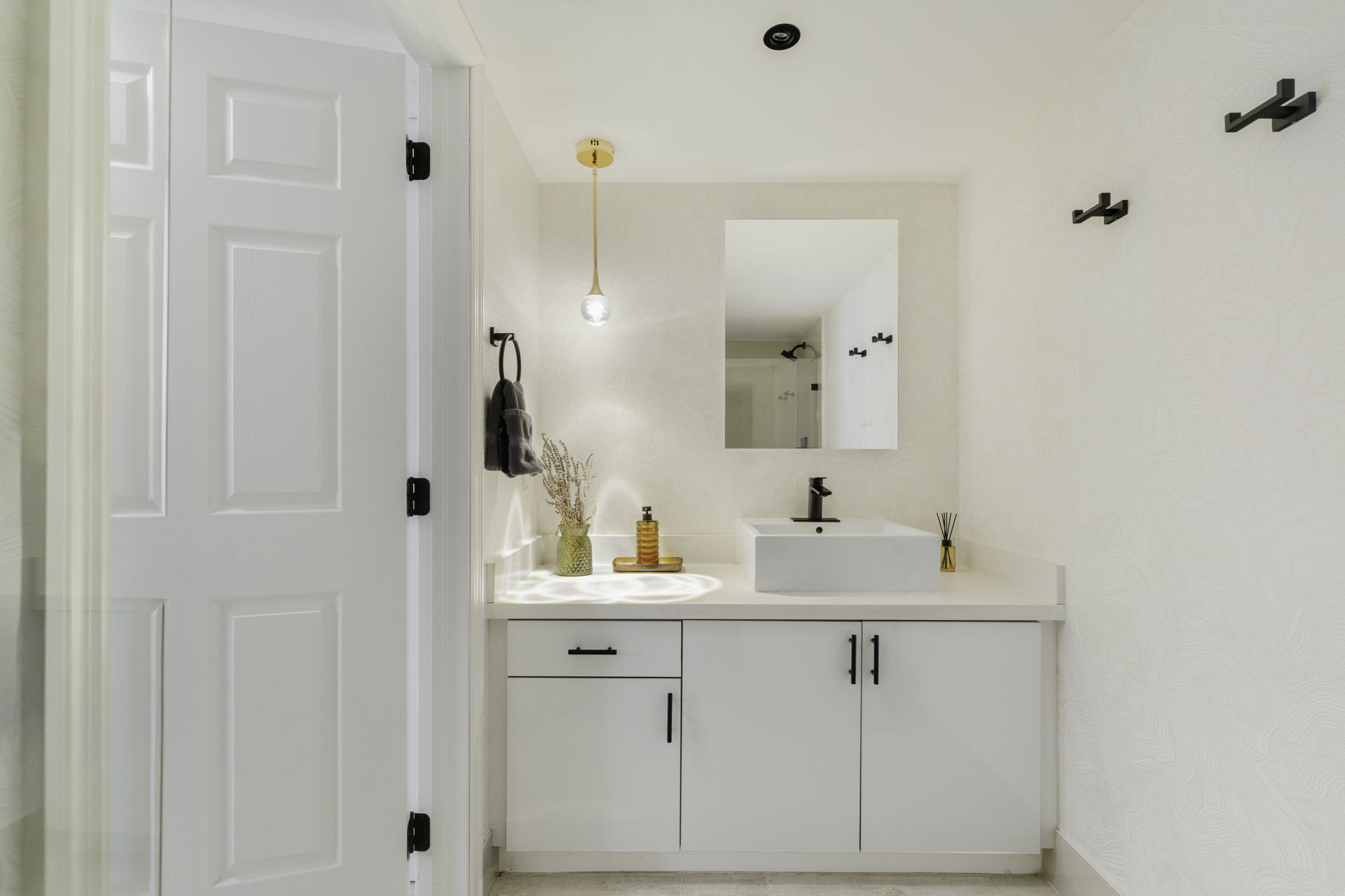 Bathroom vanity with vessel sink and pendant light