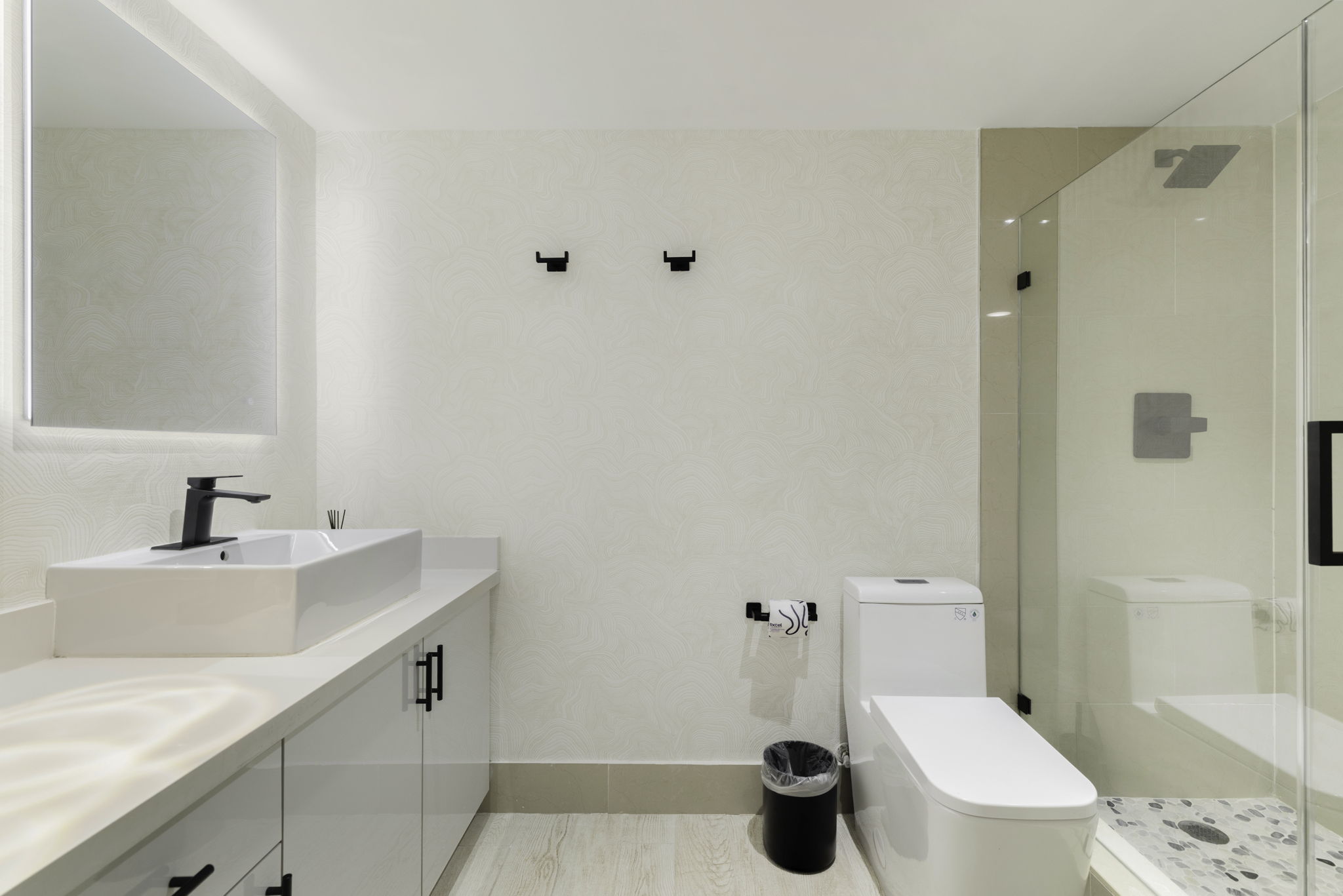 Full bathroom with walk-in glass shower and vessel sink