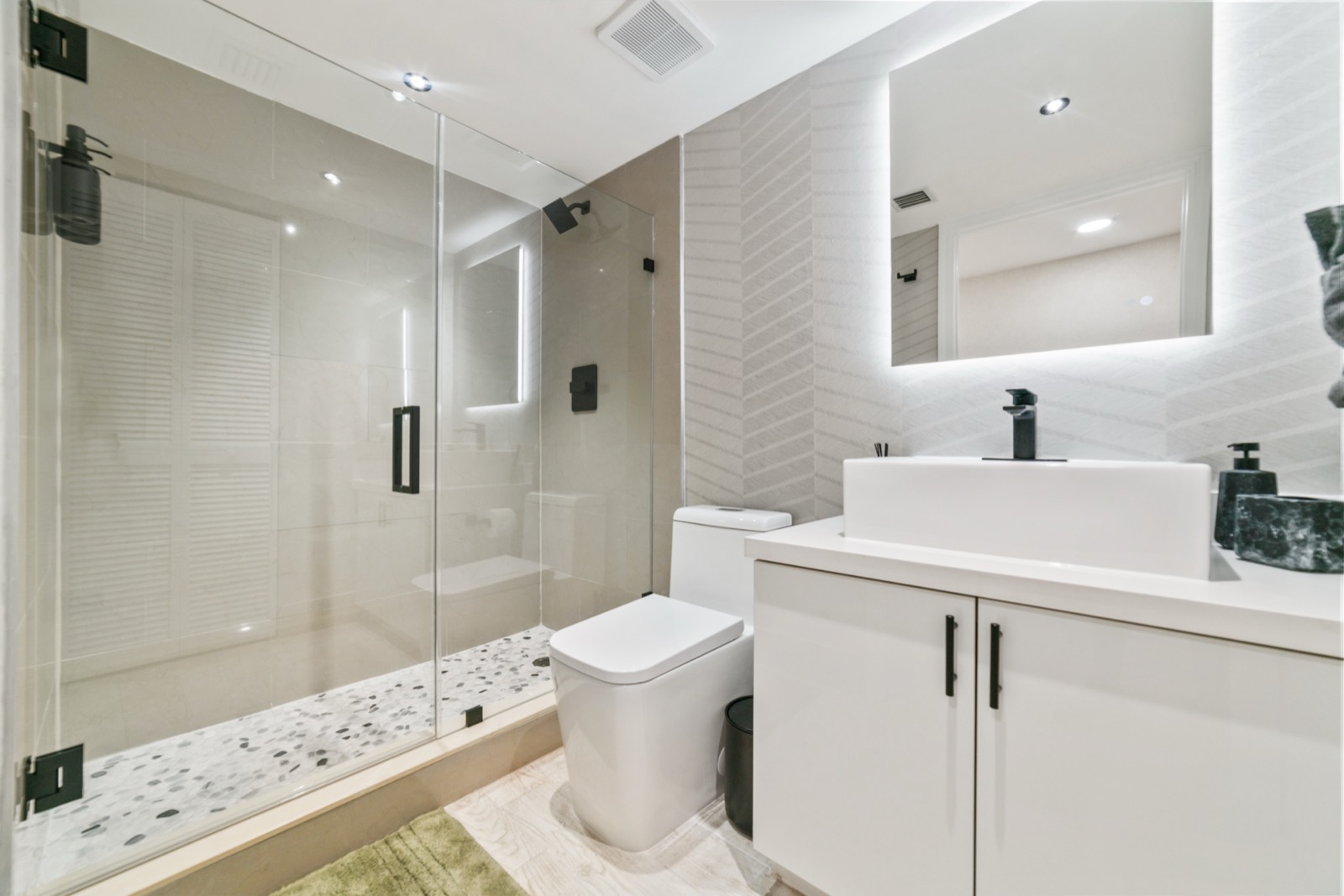Full bath with designer chevron tile