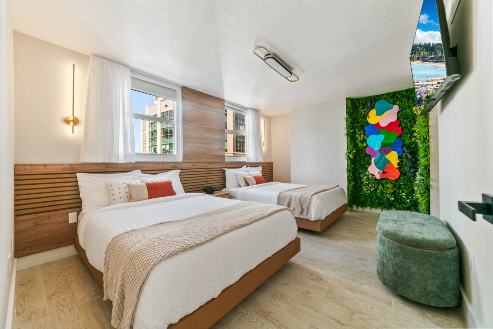 Bedroom with two beds and accent wall
