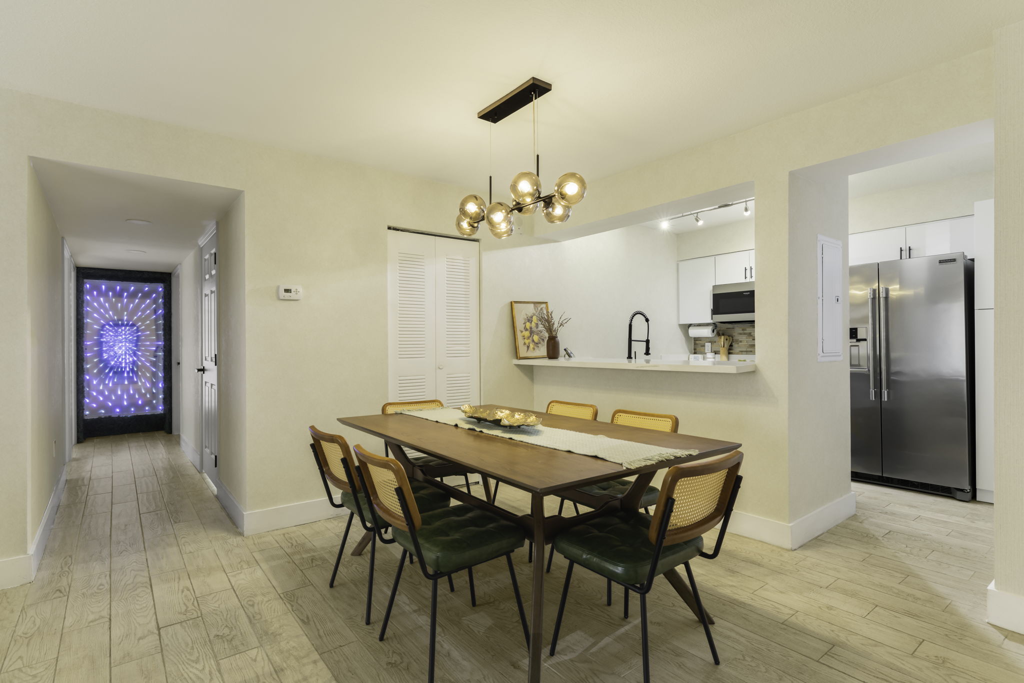 Open dining area beside the kitchen and hallway