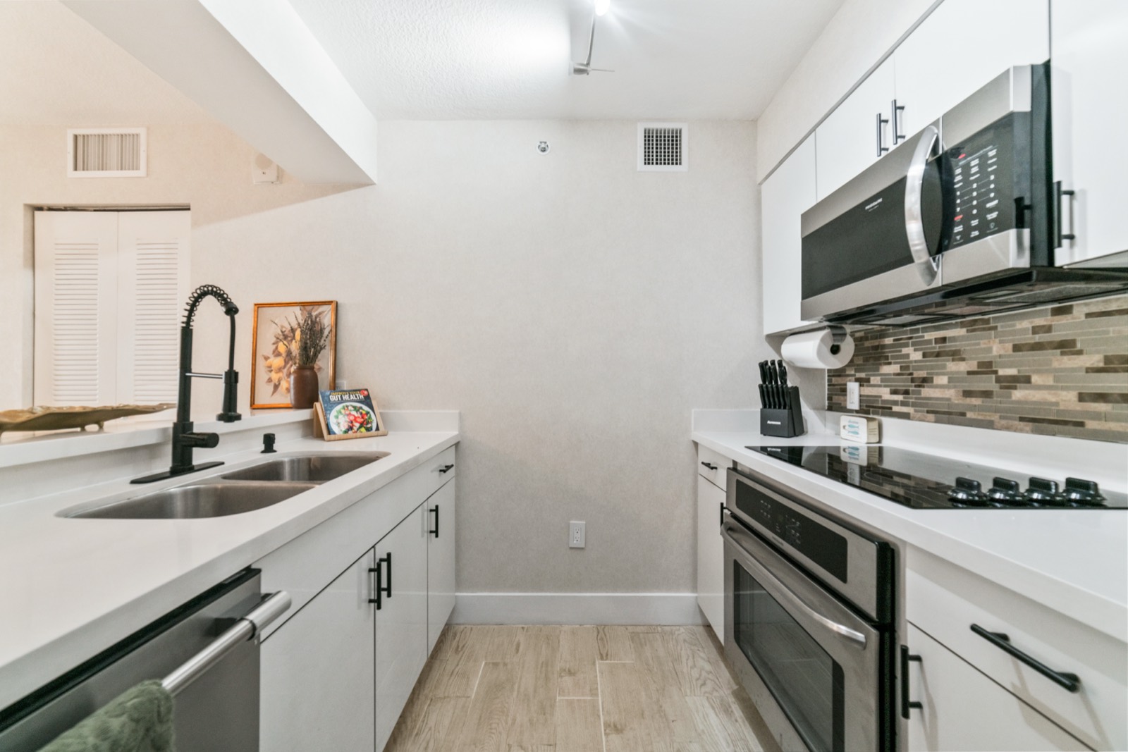 Modern kitchen with quartz counters and stainless appliances